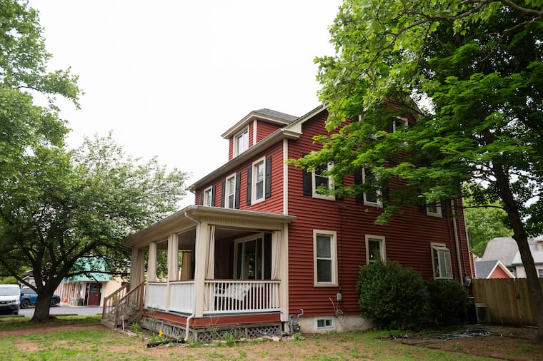 The couple loved the house's red exterior and big front porch and porch swing.