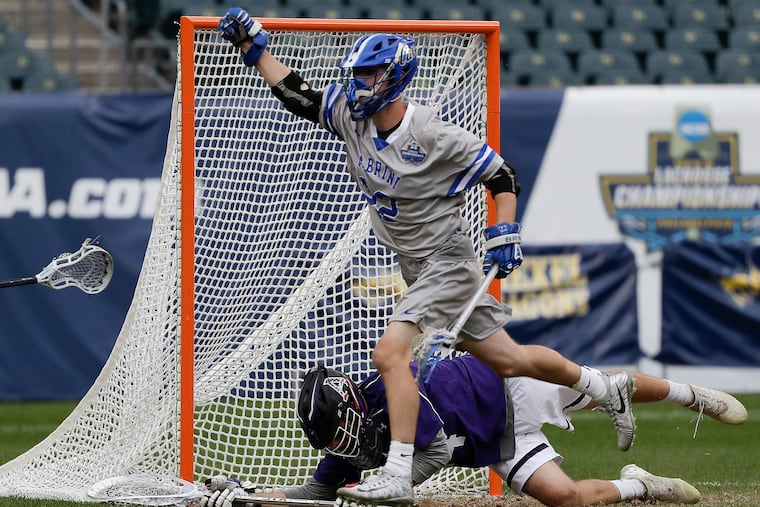 Cabrini's Bill Morgan celebrates shooting a third-quarter goal past Amherst's Gib Versfeld on Sunday at Lincoln Financial Field.
