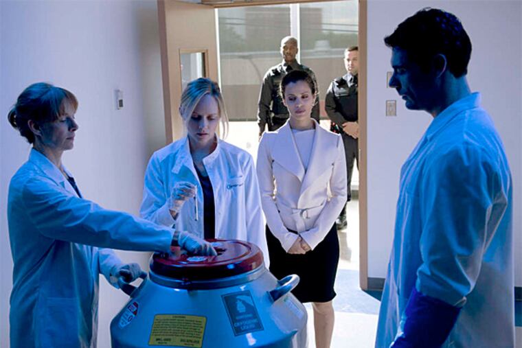 Marley Shelton (center) portrays a scientist who makes a research breakthrough in the new 10-part drama series "The Lottery," Sundays on Lifetime. (Phillipe Bosse)