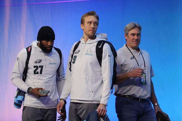 The Eagles’ (from left) Malcolm Jenkins, Nick Foles, and Doug Pederson take the stage Monday at Super Bowl Opening Night.