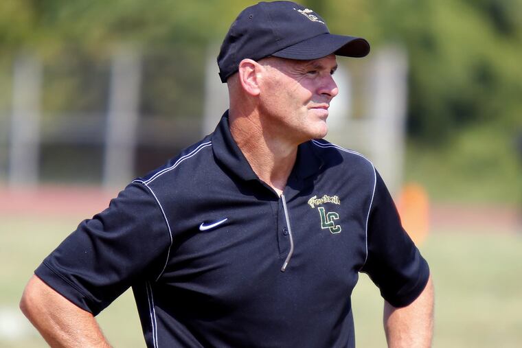 Lansdale Catholic football coach Tom Kirk watches the action against Archbishop Ryan in 2016. He retired on Friday.