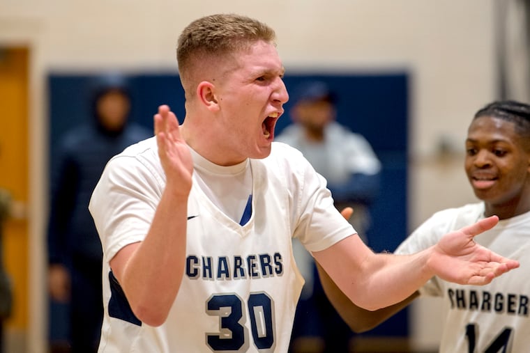 Timber Creek's Tim Schultice (left) and Eric Benjamin (right) celebrate Schultice's basket in 58-57 win over Winslow Township.