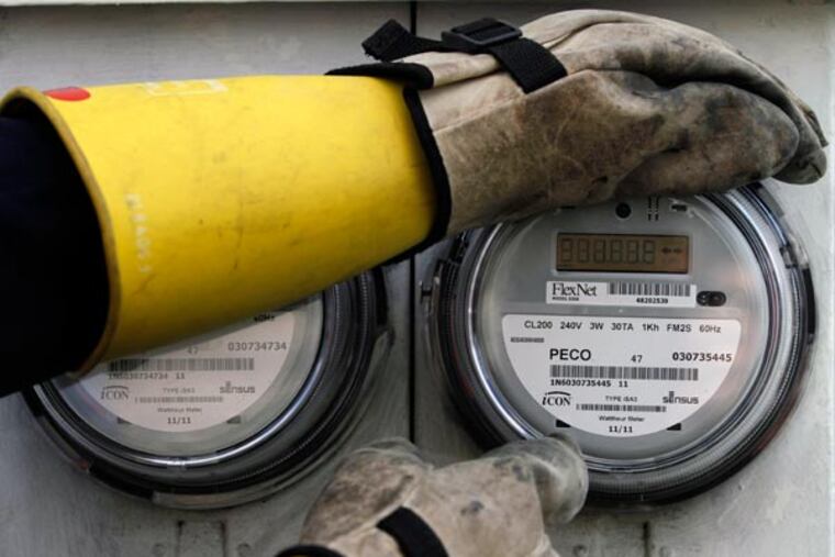 Steven Carbonara, a PECO field technician, installs an upgraded meter in a home in Bristol on April 10, 2011. PECO Energy Co. began installing the first generation of 6000,000 new-generation electric meters in March. They allow the company to give the customer more detailed information about their energy use. ( MICHAEL S. WIRTZ / Staff Photographer )