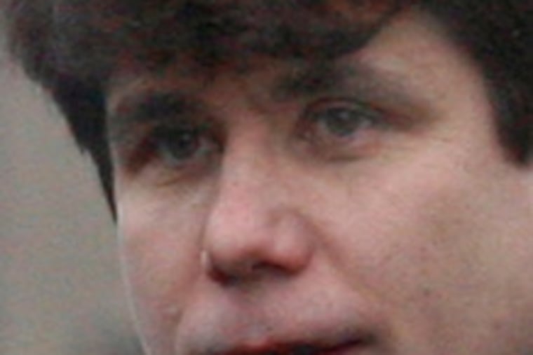 Gov. Blagojevich leaving home to go to his office yesterday.