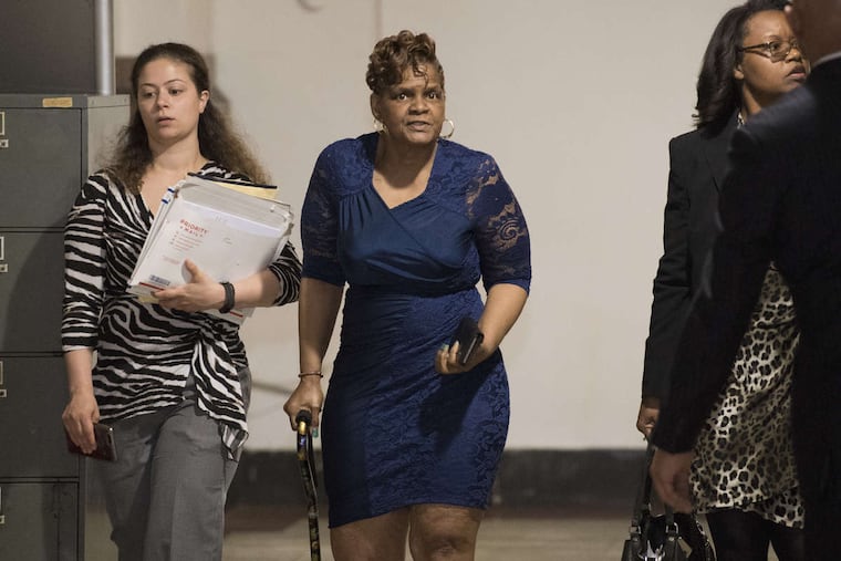 Gloria Byars, center, walked inside Philadelphia City Hall in May 2018 for a prior hearing before Orphans' Court Judge John Herron. At right was her attorney, Sharon Alexander; at left was an assistant.