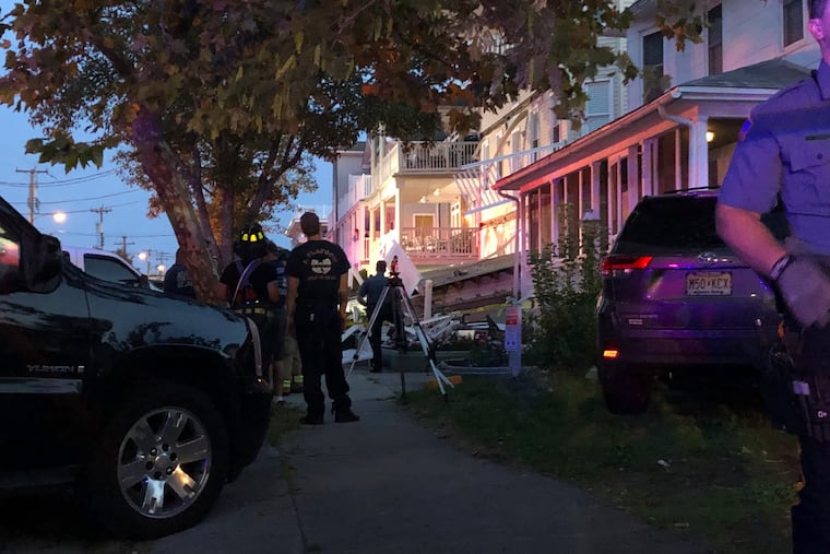 First responders work the scene of a building structure damage in Wildwood, N.J., Saturday, Sept. 14, 2019. Officials say several people were injured when decks collapsed on one another at the three-story residence on the Jersey Shore.