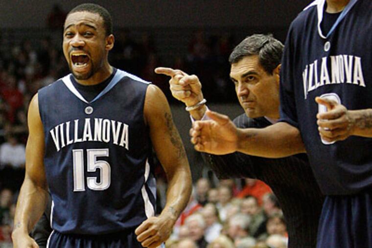 Reggie Redding and Jay Wright celebrate after a key play late in the game. (Al Behrman/AP)
