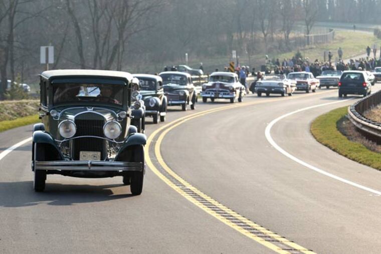 An antique car procession on Monday ceremoniously opened the Route 202 parkway. Charles Fox / Staff Photographer