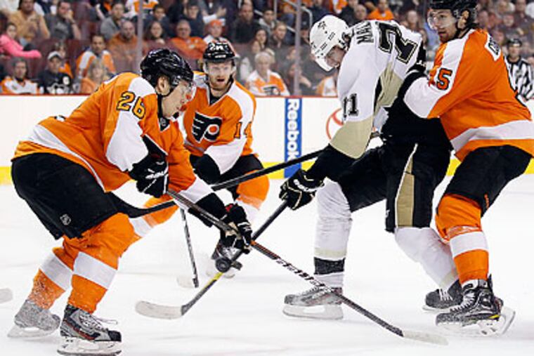 The Flyers lack a primary scorer such as Evgeni Malkin (center), but they still have a potent offense. (Yong Kim/Staff file photo)