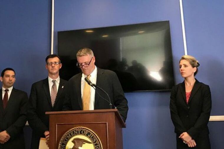 Federal law enforcement officials spell out an assault and bias crime complaint filed against a former police chief of Bordentown Township, N.J., on Wednesday, Nov. 1, 2017. The chief allegedly spouted racial slurs and injured a handcuffed African American suspect.