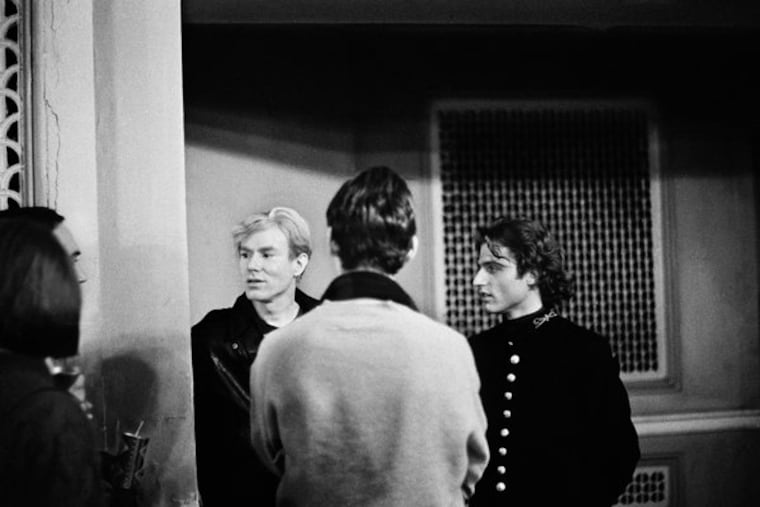 Andy Warhol and Gerard Malanga at the Exploding Plastic Inevitable at the Young Men's & Women's Hebrew Association on south Broad Street in December 1966.