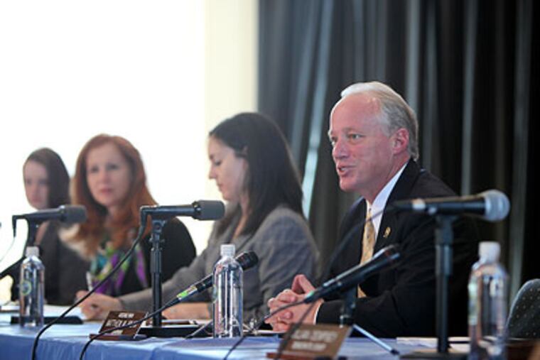 Assembly Tourism and the Arts Committee Chairman Matthew W. Milam greets former Burlington City Mayor Herman T. Costello. (David Swanson / Staff Photographer)