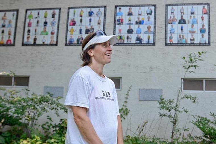 Photographer Sabina Pierce pulled rowers aside on Boathouse Row to photograph them with her iPhone that she feels made them more comfortable as subjects for her six-piece photo exhibit titled "Faces of Rowing." (Viviana Pernot/Staff Photographer)