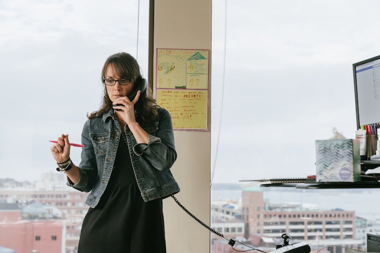 Kate Simson, state office representative for Sen. Susan Collins, R-Maine, fields phone calls from constituents about their opinions on Brett Kavanaugh's nomination to the U.S. Supreme Court in Collins' Portland office on Thursday.