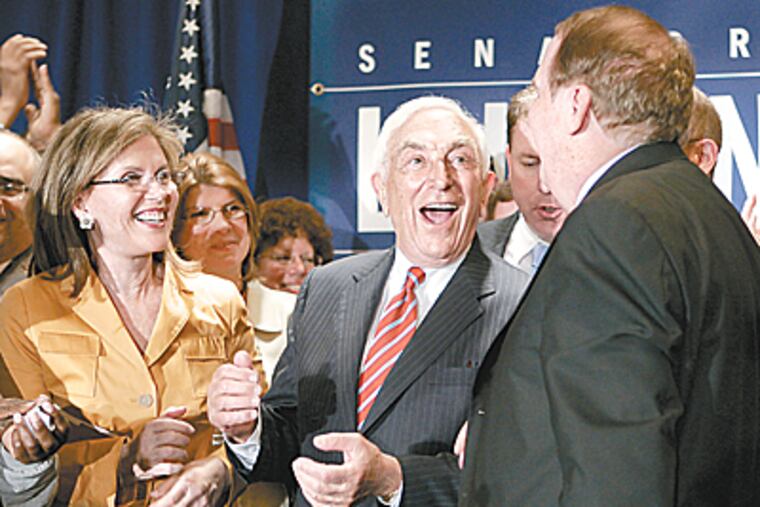 Sen. Frank Lautenberg, D-N.J., center, celebrates his victory with wife, Bonnie, left, and state Sen. President Richard Codey, right. Lautenberg defeated Congressman Robert Andrews. (AP Photo/Mike Derer)