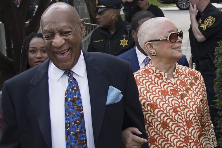 Bill Cosby, left, smiles as he arrives at the Montgomery County Courthouse with his wife, Camille, for his sexual assault trial on April 24, 2018.