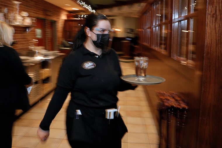Server Grisilda Nika said “it feels good to be back” as she waited on guests at Gallo’s Seafood restaurant on the Roosevelt Blvd on Jan. 16.
