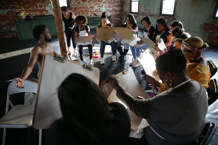 Nude model Steve Jackson, left, poses during a bachelorette party “social sketching†session at Fig Leaves Philly in Philadelphia, PA on March 30, 2019.