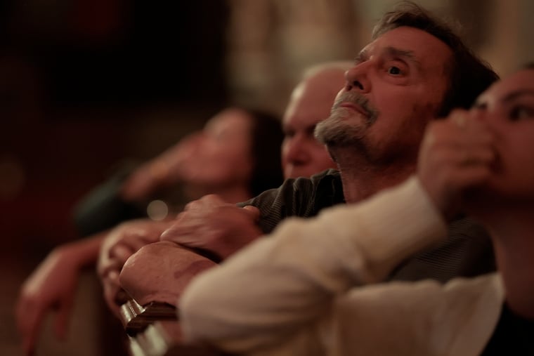 Joseph Blanch of Havertown watches the opening night performance of LUMINISCENCE Philadelphia: An Immersive Celebration of Light, Music and Story lights up the interior of the Cathedral Basilica of Saints Peter and Paul in Philadelphia on Thursday, June 11, 2026.