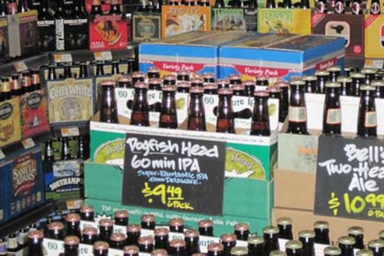 Local and craft beer six packs to go at Whole Foods’ Cold Point Pub in Plymouth Meeting. (Rick Nichols /Staff)