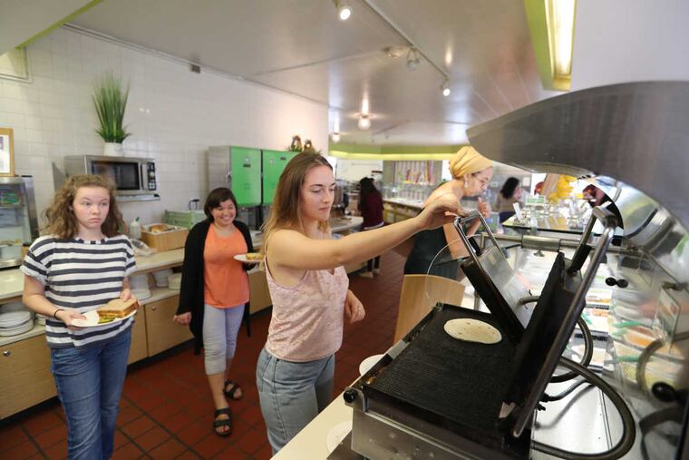 Antonia Caffrey makes a quesadilla at Erdman Dining Hall at Bryn Mawr College.