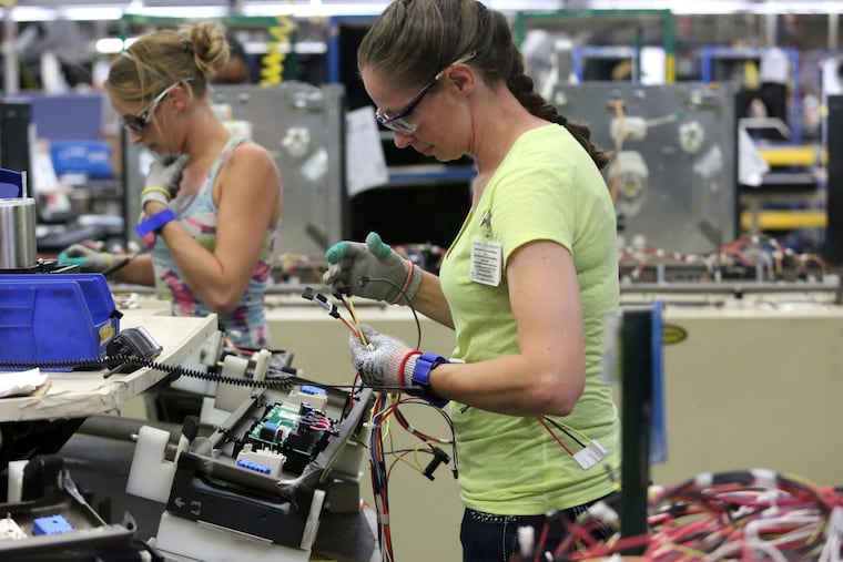 Staff photo by Erin O. Smith / Maurine Carter works on the wiring of a stove Friday, Sept. 20, 2019 at the GE Appliances' Roper Plant in LaFayette, Georgia.