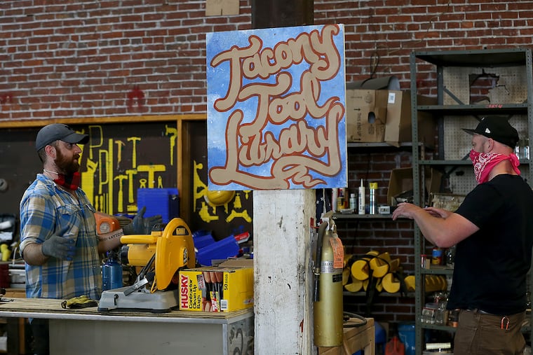 Greg Trainor (left), executive director of Philadelphia Community Corps., talks with a customer at Philly Reclaim on July 7. Trainor created the Tacony Tool Library, the city's second such library, which opened July 1. It's hoping to help people tackling home improvement projects during the pandemic and beyond.