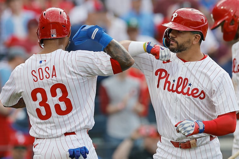 Edmundo Sosa, who gave the Phillies the lead with a two-run double, celebrates with Kyle Schwarber after Schwarber hit a two-run home run in the seventh inning.