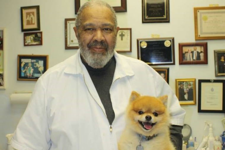 Dr. Orville R. Walls with a furry patient.
