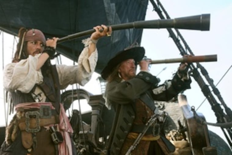 Johnny Depp (left) as Capt. Jack Sparrow and Geoffrey Rush, returning as Capt. Barbossa, swagger and spout their lines with a Shakespearean flourish.