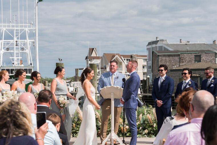 A scene from the couple's wedding ceremony. Their officiant is the bride's father's cousin Richard.
