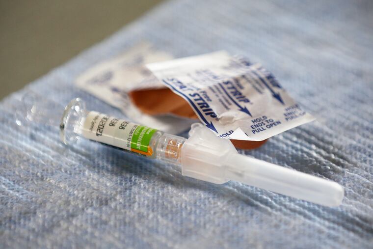 A flu vaccine syringe.