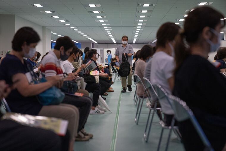 People wait in an observation area after receiving the Moderna vaccine on June 30, 2021 in Tokyo, Japan. The company has said it has said it expects coronavirus vaccine sales to top $19 billion in 2022. (Carl Court/Getty Images/TNS)