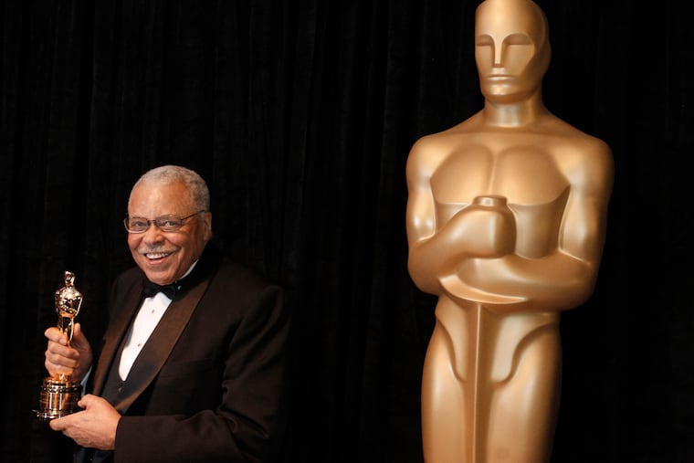 James Earl Jones poses with his honorary Oscar at the 84th Academy Awards in 2012. Jones, who overcame racial prejudice and a severe stutter to become a celebrated icon of stage and screen, died Monday at age 93.