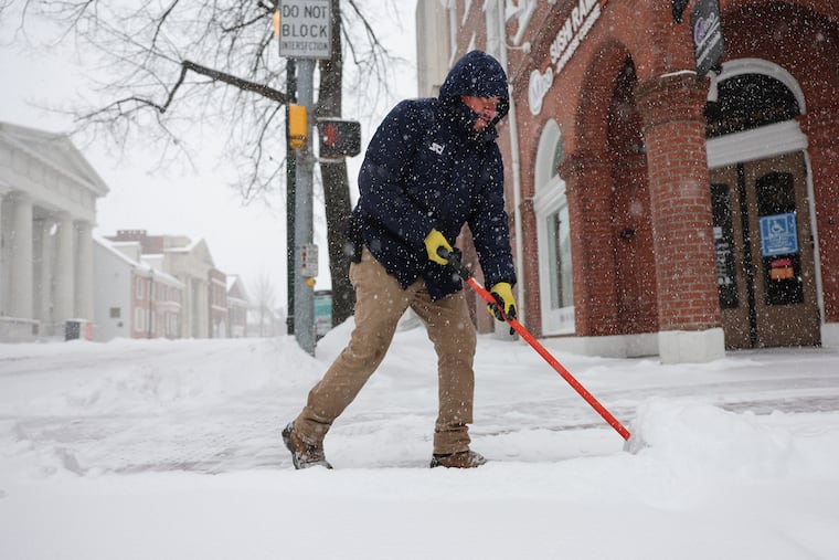 A snow shoveler on Sunday. The region saw the largest winter storm in a decade over the weekend.