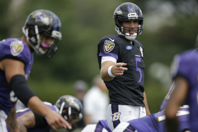 Joe Flacco directs the offense during the Ravens' joint practice with the Eagles.