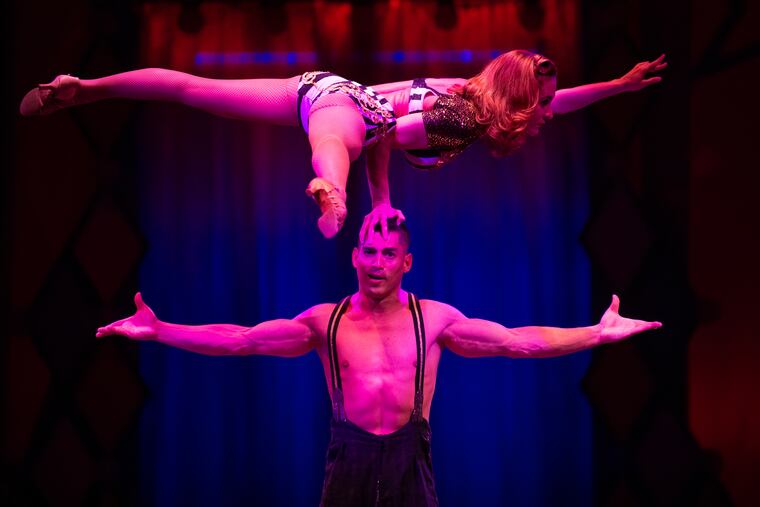 Virginia Tuells balances on the head of Ihosvanys Perez during a performance of the Big Apple Circus in Oaks, Pa. on Wednesday.