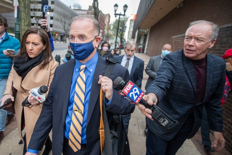 Eric L. Gibson (center) outside the federal courthouse in Philadelphia in 2022.