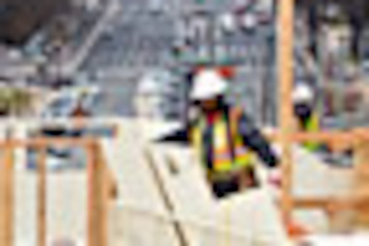 With forty days until President Barack Obama is sworn in for a second term, construction continues on the platforms on the west side of the Capitol, looking down Pennsylvania Avenue in Washington, Tuesday, Dec. 11, 2012, where dignitaries and news cameras will witness the inauguration ceremonies, Tuesday, Dec. 11, 2012. The Old Post Office Pavilion is at left. (AP Photo/J. Scott Applewhite)
