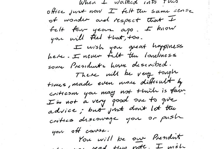 This image provided by the George H.W. Bush Presidential Library and Museum shows a note written by George H.W. Bush to Bill Clinton. (George H.W. Bush Presidential Library and Museum via AP)
