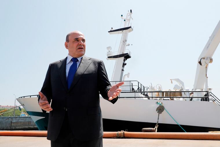 Russian Prime Minister Mikhail Mishustin, shown here in July 2021, was one of the targets of the U.S. sanctions.