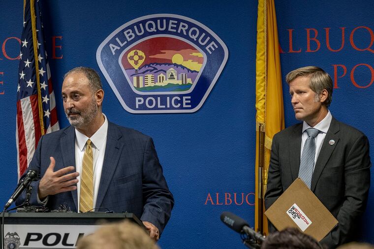 Ahmad Assed, president of the Islamic Center of New Mexico, speaks at a news conference to announce the arrest of Muhammad Syed, a suspect in the recent murders of Muslim men in Albuquerque, N.M., as Albuquerque Mayor Tim Keller listens.