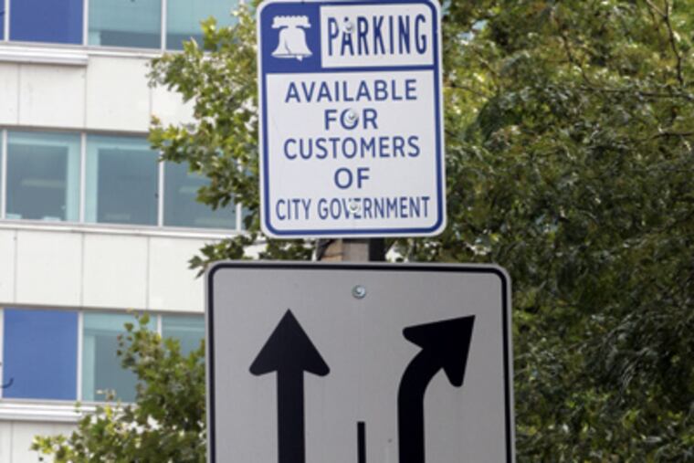 A sign of parking progress: “Customers of city government” may now park on 15th Street between Arch and JFK Boulevard, an area once dubbed “authorized only.” (Bonnie Weller / Staff Photographer)
