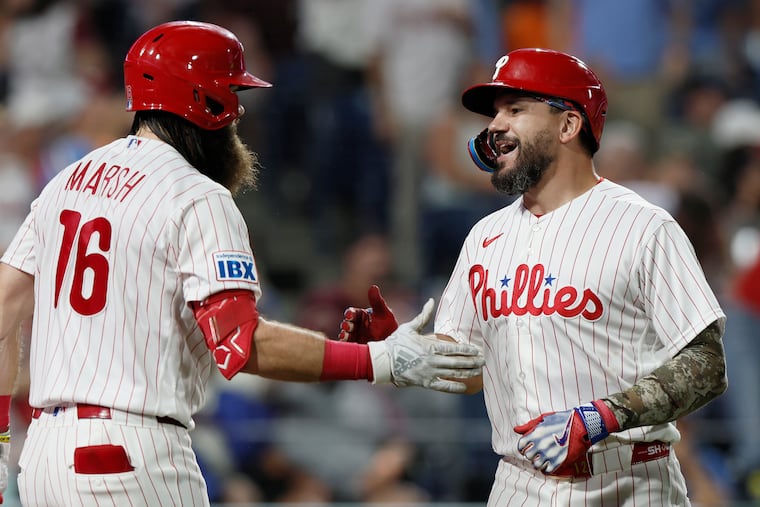 Brandon Marsh (left) greets Kyle Schwarber after Schwarber’s solo home run on Aug. 22.