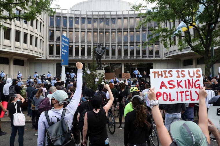 Protesters gather in front of the Philadelphia Police headquarters on Race Street in Philadelphia, Pa. on Sunday, May 31, 2020., as demonstrations continued following the death of George Floyd in Minneapolis.