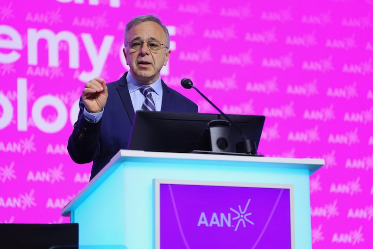 Majid Fotuhi addresses an American Academy of Neurology event in Chicago in April. (Will Evans)