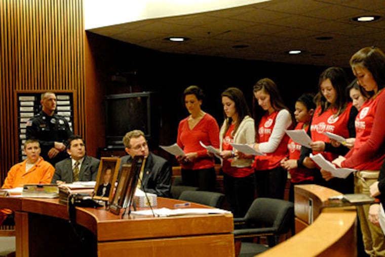 In Burlington County Court, Thomas Thorn, Jr. is sentenced in the vehicular manslaughter of Shawn English. In this photo, a group of teens, who were coached by Shawn English, and Shawn's sister, Courtney English, address the court. Thorn is at left. (April Saul / Staff Photographer)