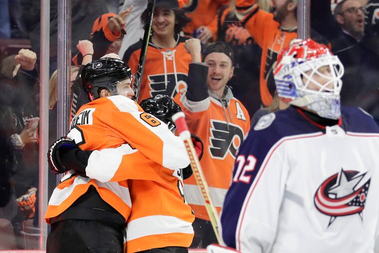 Travis Sanheim (left) celebrates a goal last season against then-Blue Jackets goaltender Sergei Bobrovsky.