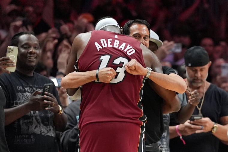 Heat coach Erik Spoelstra hugs Bam Adebayo as he leaves the game after scoring 83 points against the Wizards on Tuesday.