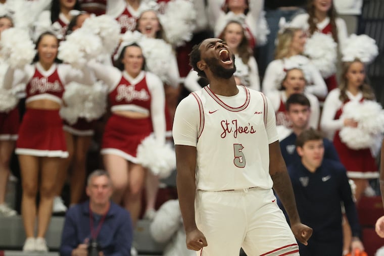 Anthony Finkley of St. Joseph's celebrates after making a three-pointer against Villanova during Tuesday's Big 5 Classic game.